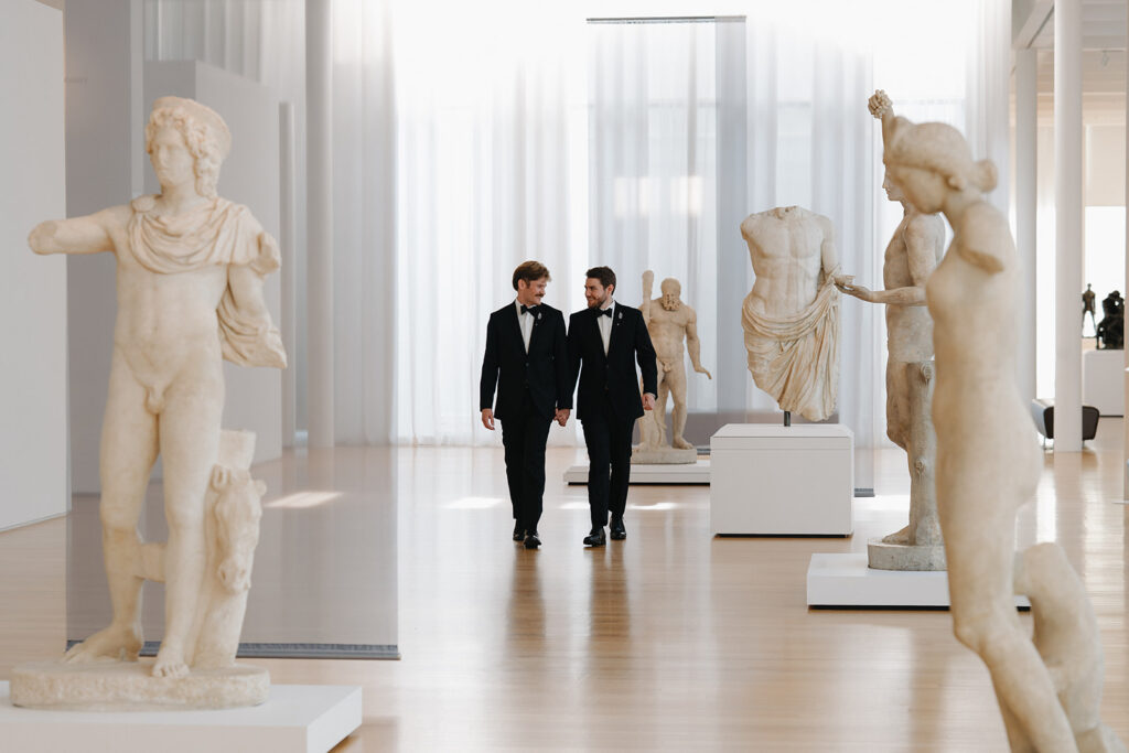 couple walking holding hands through the art gallery at the NCMA raleigh