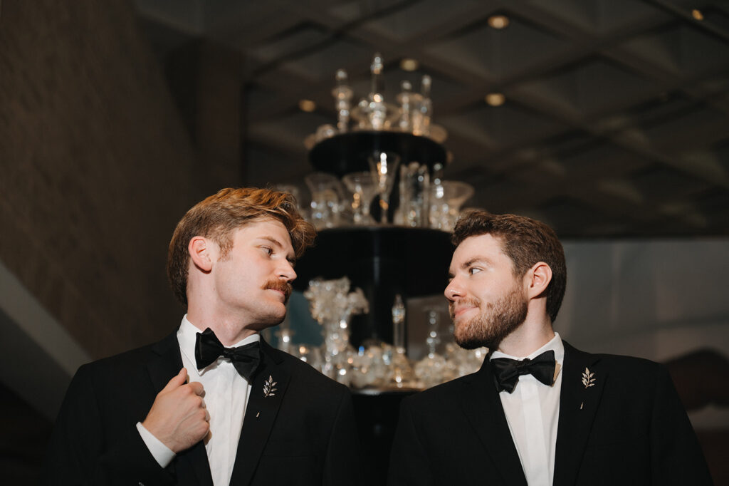 lgbtq couple posing at an art installation at the NCMA in raleigh