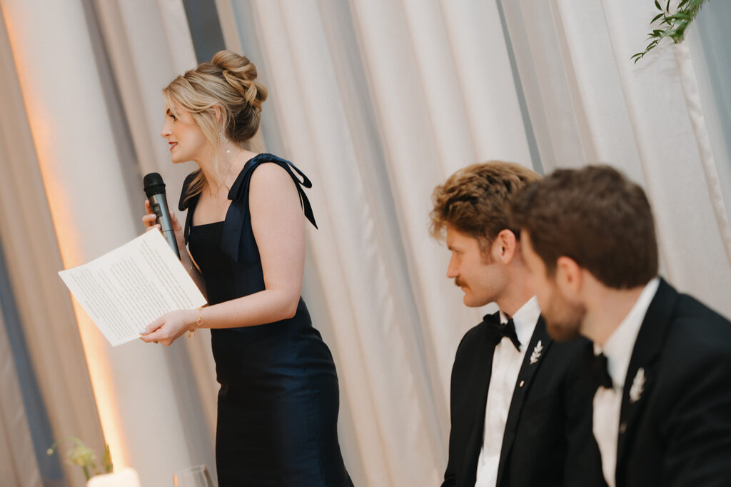 maid of honor gives her wedding speech to the couple